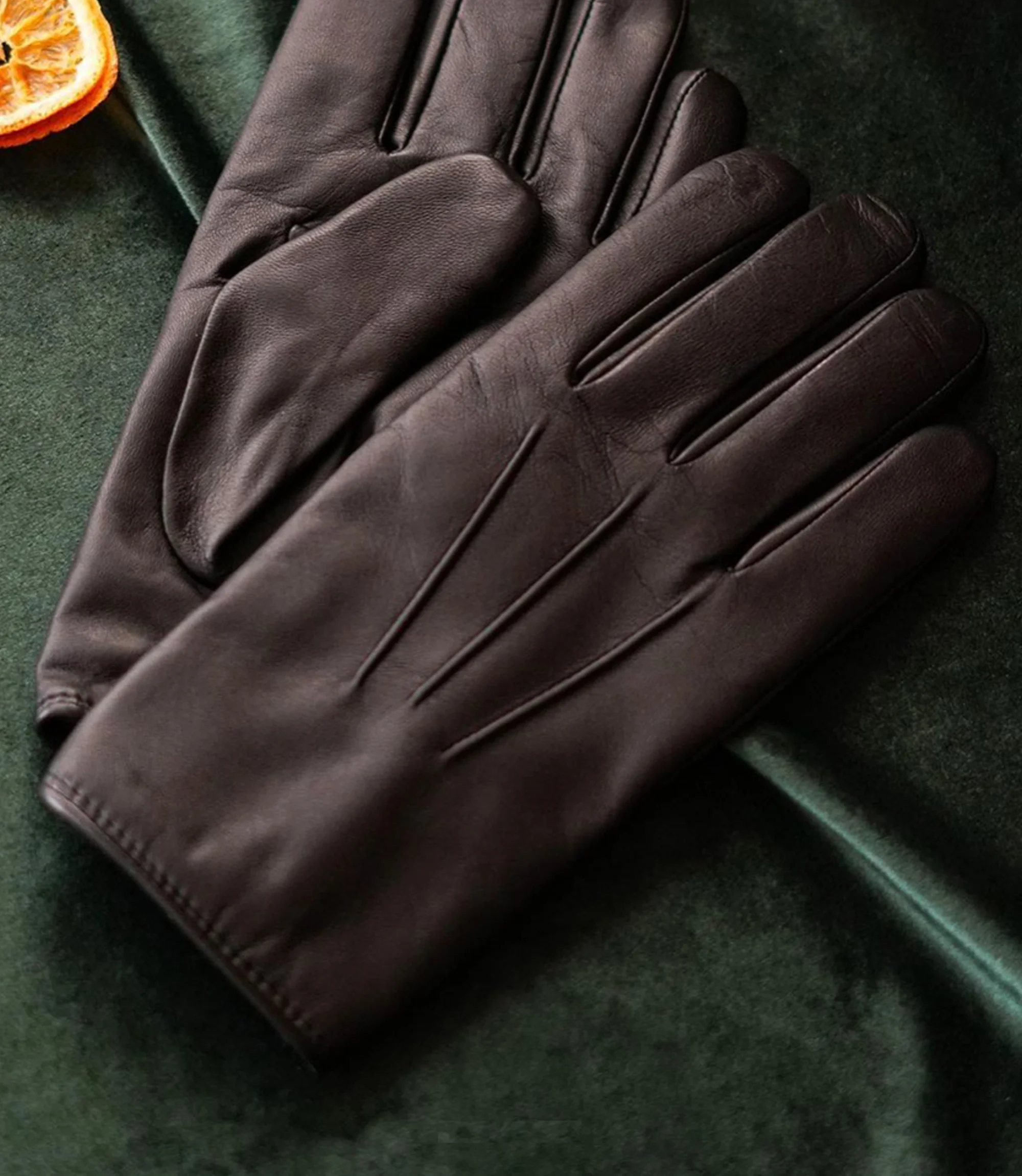 A pair of Loake Shackleton Gloves in Black Calf Leather placed on a table on their own.